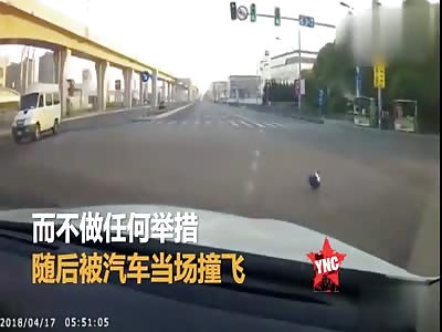 male rides a red light in Hainan