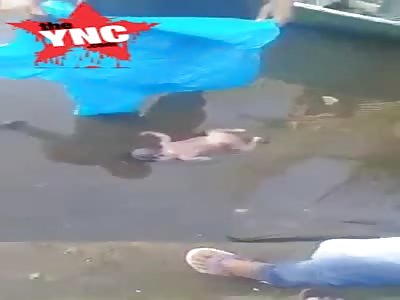 female dead baby floating in Puteh River