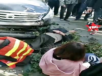  1 death and 9 injuries when a black car  collide with workers who was just about dismantled  illegal buildings in  Yangzhou
