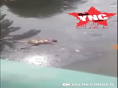 The dead body of a woman floating in the CBL Canal in  Muara Bakti Village