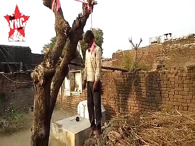 youth hangs from a tree In the village of Dhanla in Marwar