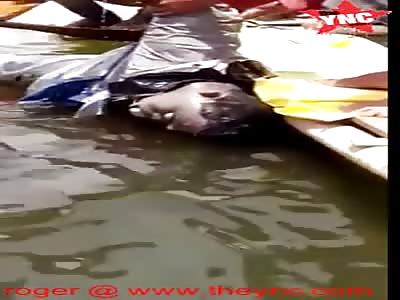 A dead fisherman floating  in the Jatigede Reservoir, Sumedang, West Java
