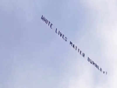 White lives matter banner condemned in UK.