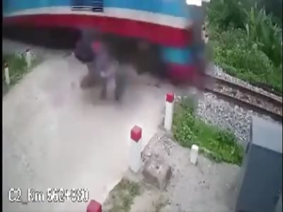 Girl on a scooter is hit by a train and broke her back.