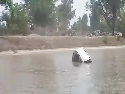  Car sinks into a river