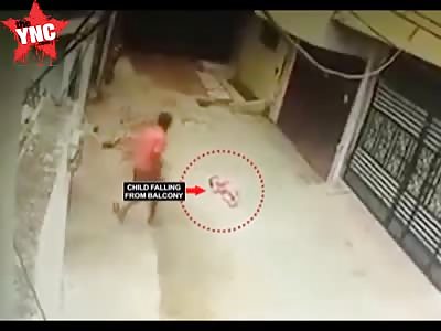 Baby falls from a balcony and hits the ground