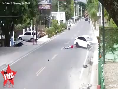 Two motorcyclists go flying after hitting a car