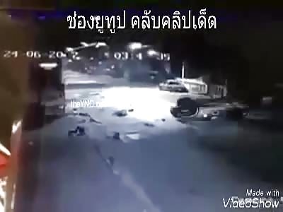 Car crashes into motorcyclist then flips upside down