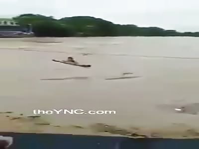 Man is swept away by flood water