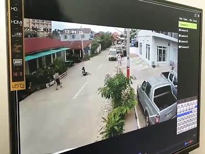 Woman is dragged along road by thieves on a motorbike