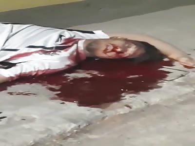 Man lays dead in a pool of blood
