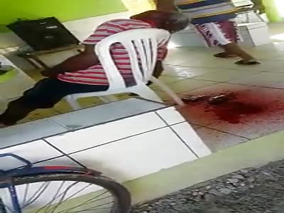 Blood pouring out of shot mans head 