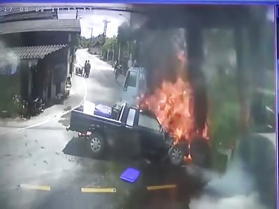 Pickup crashes into truck and bursts into flames