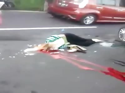 Womans Brains and Blood Smeared on the Road