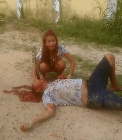 Woman Cries Over Murdered BF With Machete Still Stuck in Face