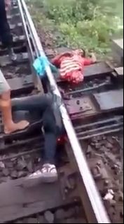 Still Alive Man Torn in Two by Train is Put into Bodybag
