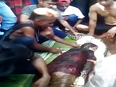 Removing Dead Womans Body From Python in Sulawesi Indonesia (Better Angle)
