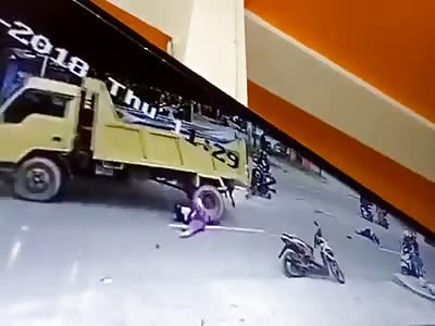Passing Truck Runs Over Him in Indonesia