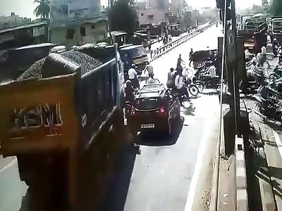 Overloaded Dump Truck Drives into a Crowded Intersection