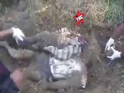The bodies of two people killed by Burmese troops