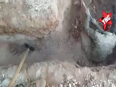 Injured man digs his own grave