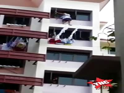 singapore, man throws himself out of building