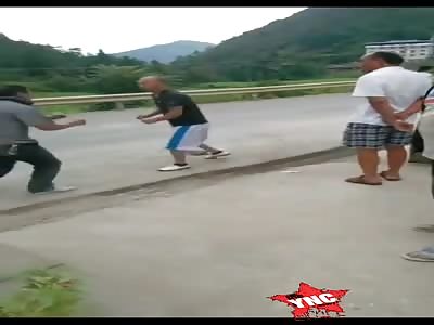 street fight, man knocked out with a stone on his head