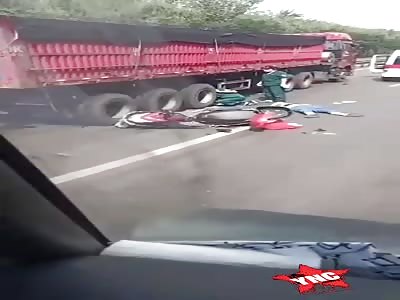 couple on motorcycle was crushed by truck