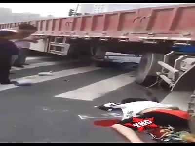 motorcyclist gets crushed by truck