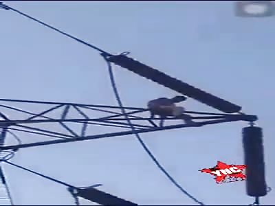 Young man jumps off electric tower (two angles & aftermath).