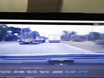 The car loses control and crashes into a cargo truck