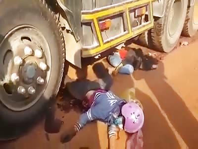two people crushed by a heavy cargo truck