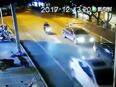 Motorcyclist goes flying when crashing with a car
