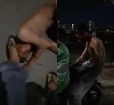Thief caught stealing is beaten in the middle of the street by angry young people