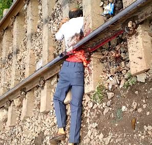 Suicidal man Cut perfectly in Half by train lines