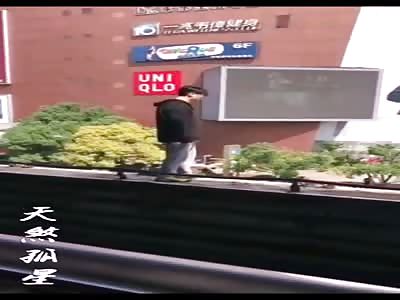 Asian boy commits suicide jumping from the building balcony