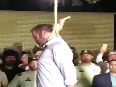 Policemen hang a man