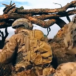 Ukrainian Soldier Getting Shot In the Head as He Prepares to Fire His Machine Gun