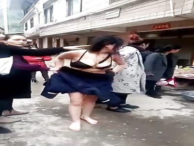 Chinese woman paraded naked