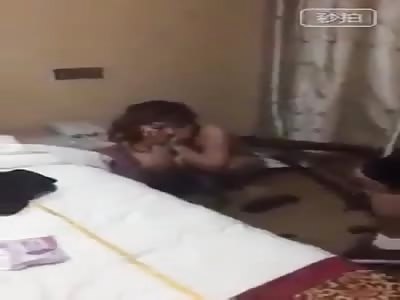 Chinese policeman kicks naked woman