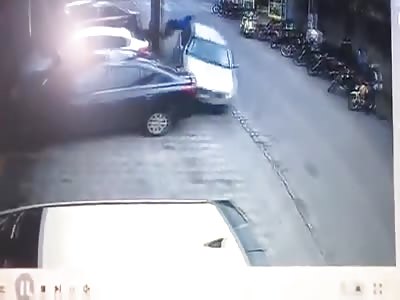 Car wipes out a biker and pedestrian in Brazil.