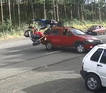 BOOM! Speeding Biker Crashes Head First into Turning Car