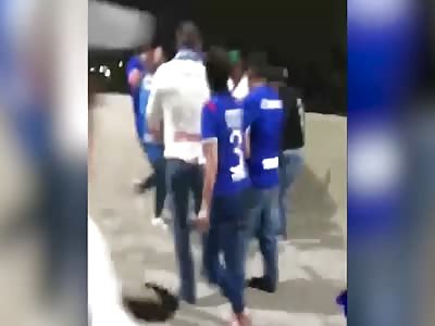 Mexican soccer fans gang up on a man who supports rival team