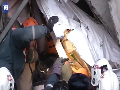 Baby is pulled out alive from rubble of apartment block in Russia
