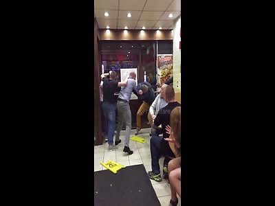Four men brawl inside London chicken shop...