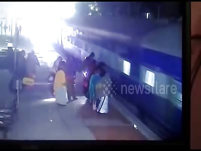 Onlookers rush to rescue woman with saree stuck in moving train