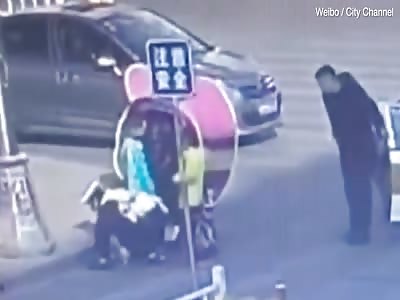 Toddler dragged under wheel of his mother's scooter after falling