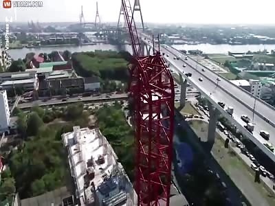 Builder hangs on for life after crane collapses killing four