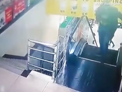 Shopper steps off escalator ONE SECOND before it collapses