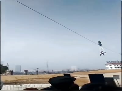 Motorcycle acrobat stunt fails when the cable gives way
